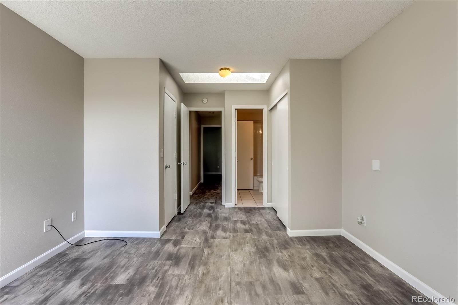 514 Longfellow Lane Highlands Ranch, CO 80126 - Photo 18 of 43 a view of a hallway with wooden floor