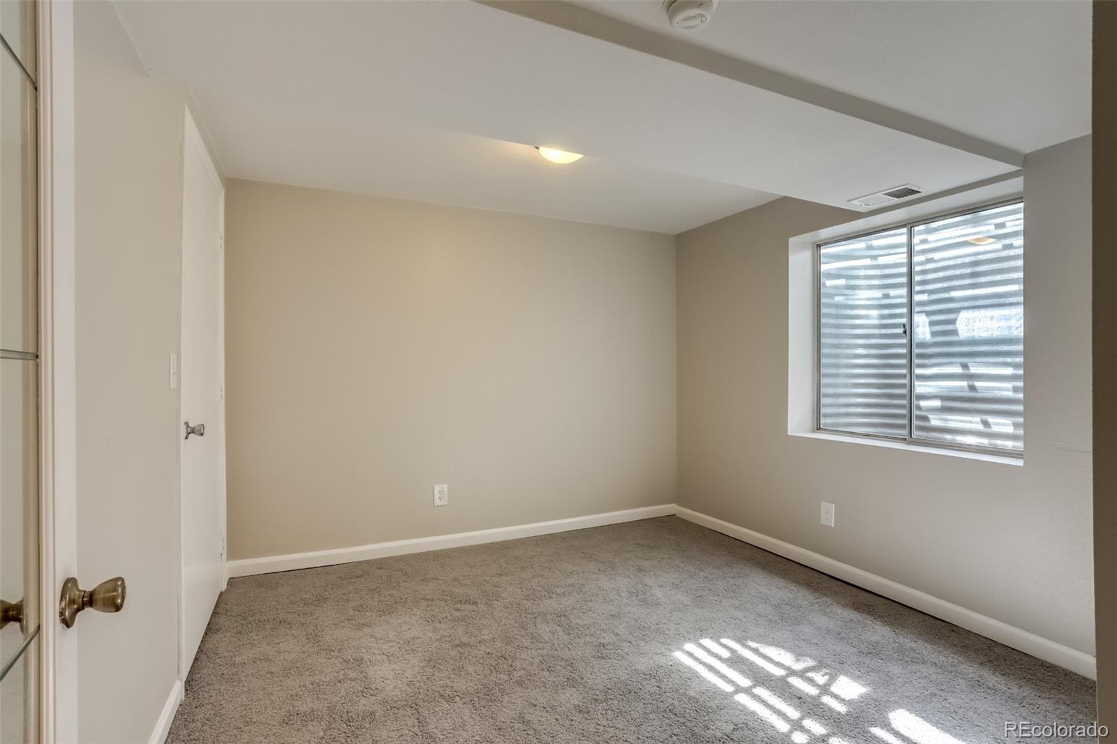 514 Longfellow Lane Highlands Ranch, CO 80126 - Photo 24 of 43 a view of an empty room with a window