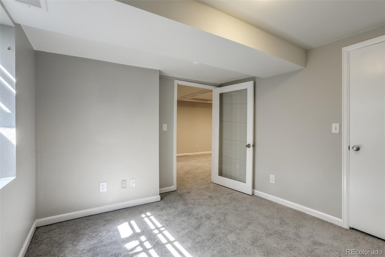 514 Longfellow Lane Highlands Ranch, CO 80126 - Photo 26 of 43 a view of an empty room and window in a room