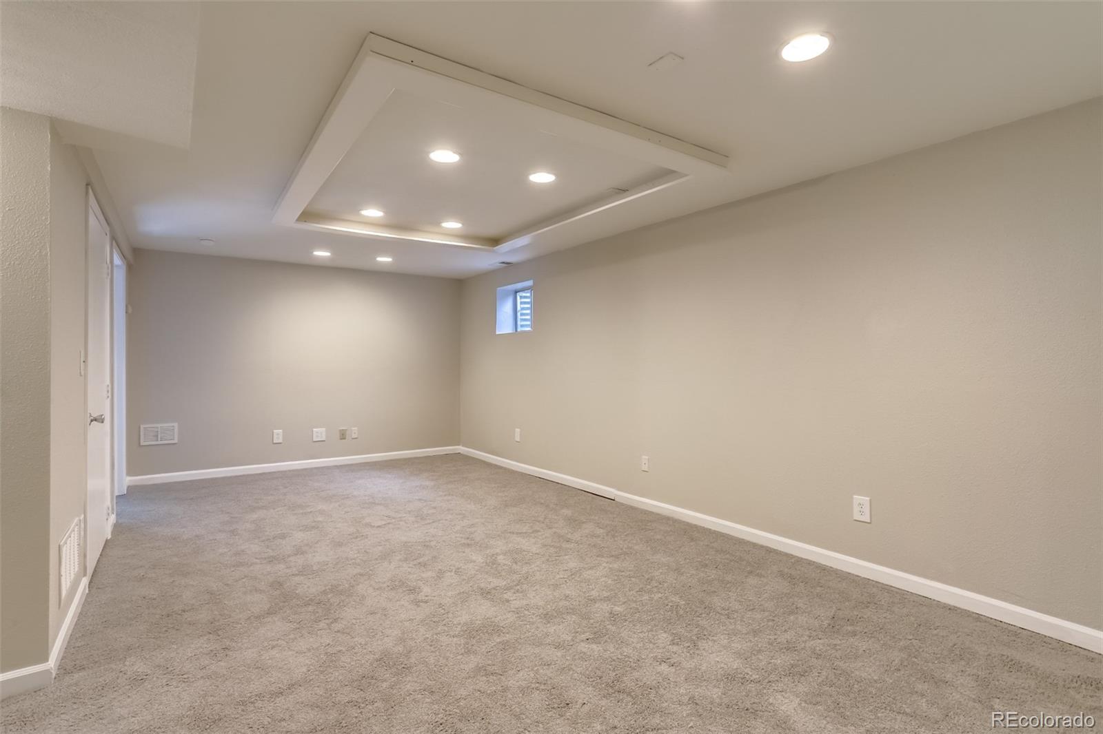 514 Longfellow Lane Highlands Ranch, CO 80126 - Photo 27 of 43 an empty room with a empty space and windows