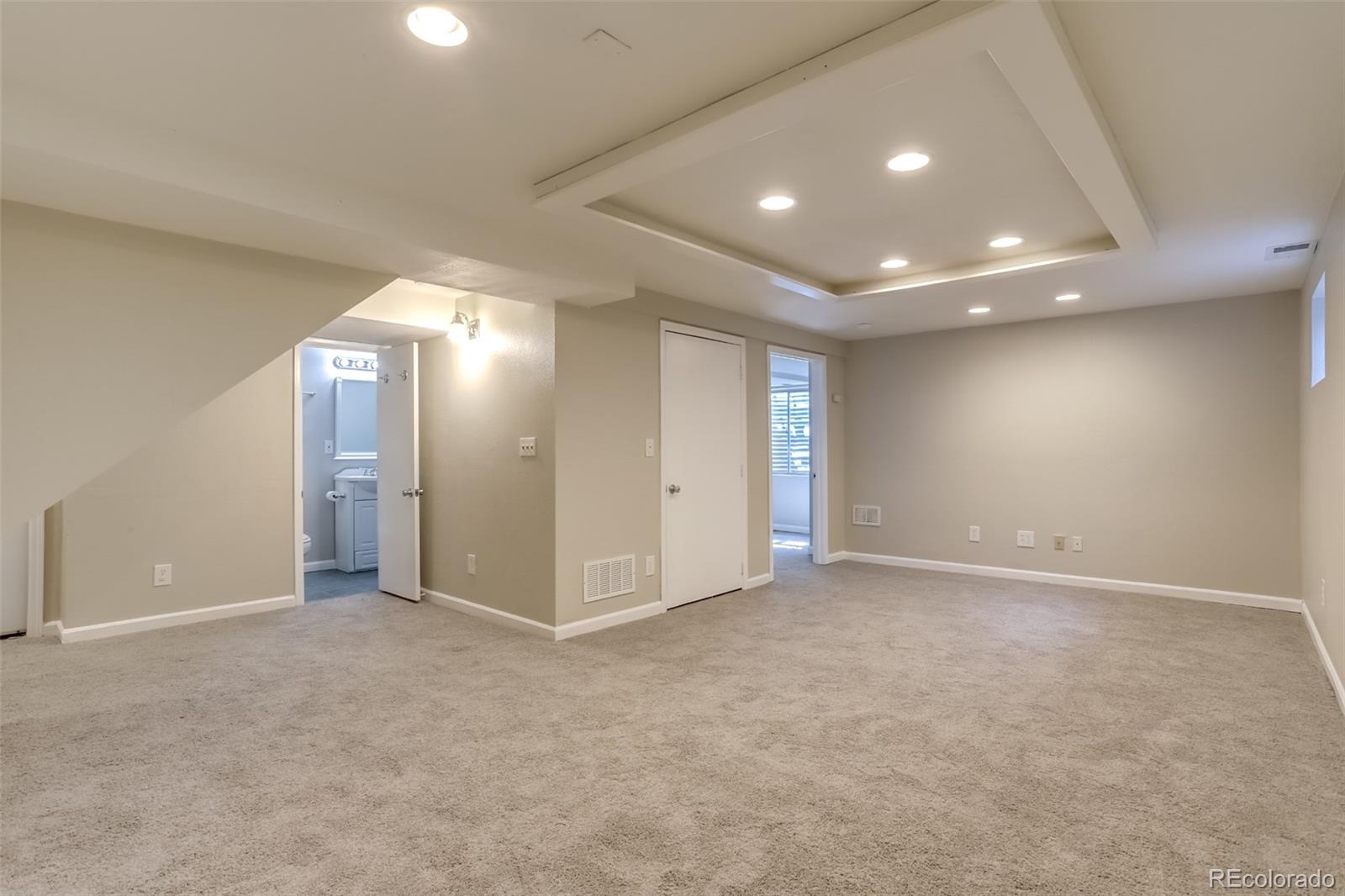 514 Longfellow Lane Highlands Ranch, CO 80126 - Photo 31 of 43 an empty room with windows and entrance
