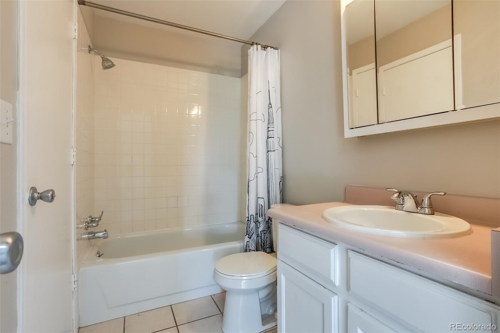 514 Longfellow Lane Highlands Ranch, CO 80126 - Photo 33 of 43 a bathroom with a sink toilet and shower