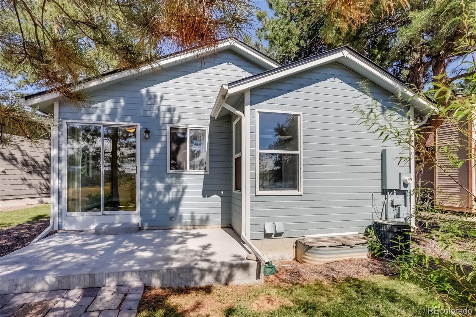 514 Longfellow Lane Highlands Ranch, CO 80126 - Photo 35 of 43 a view of a house with a yard and tree