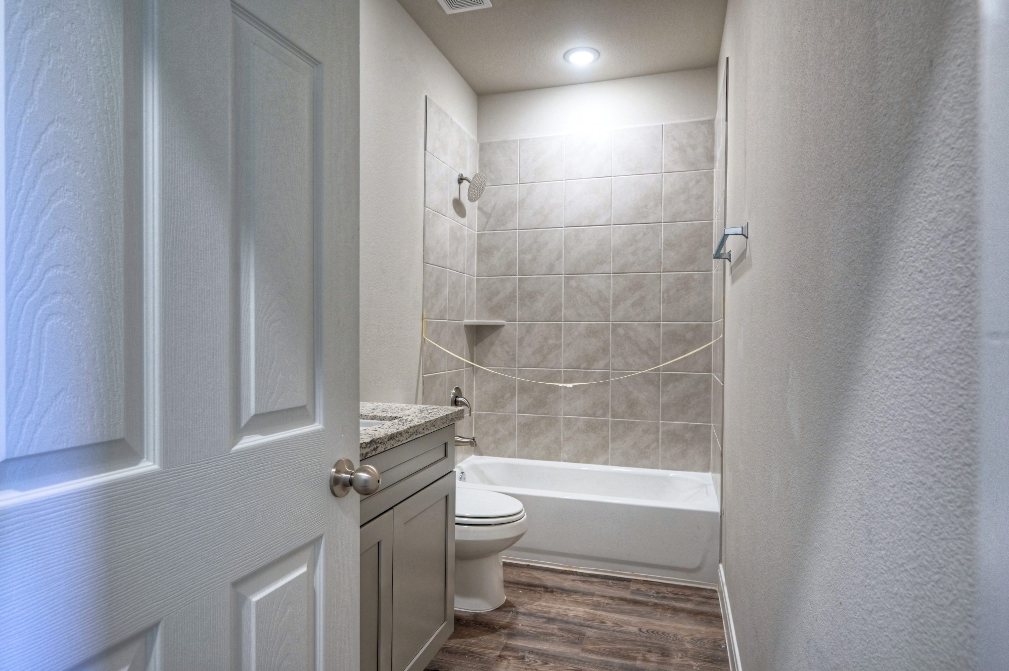 9173 Inwood Willis, TX 77318 - Photo 11 of 31 a bathroom with a granite countertop bathtub shower sink vanity and toilet