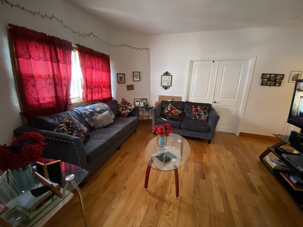 9 Starbird Street, Unit 1 Malden, MA 02148 - Photo 2 of 6 a living room with furniture window and wooden floor