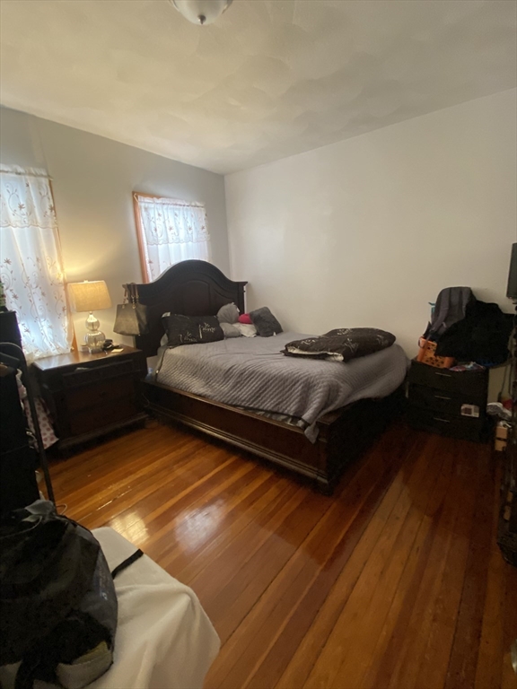 9 Starbird Street, Unit 1 Malden, MA 02148 - Photo 4 of 6 a bedroom with bed and window