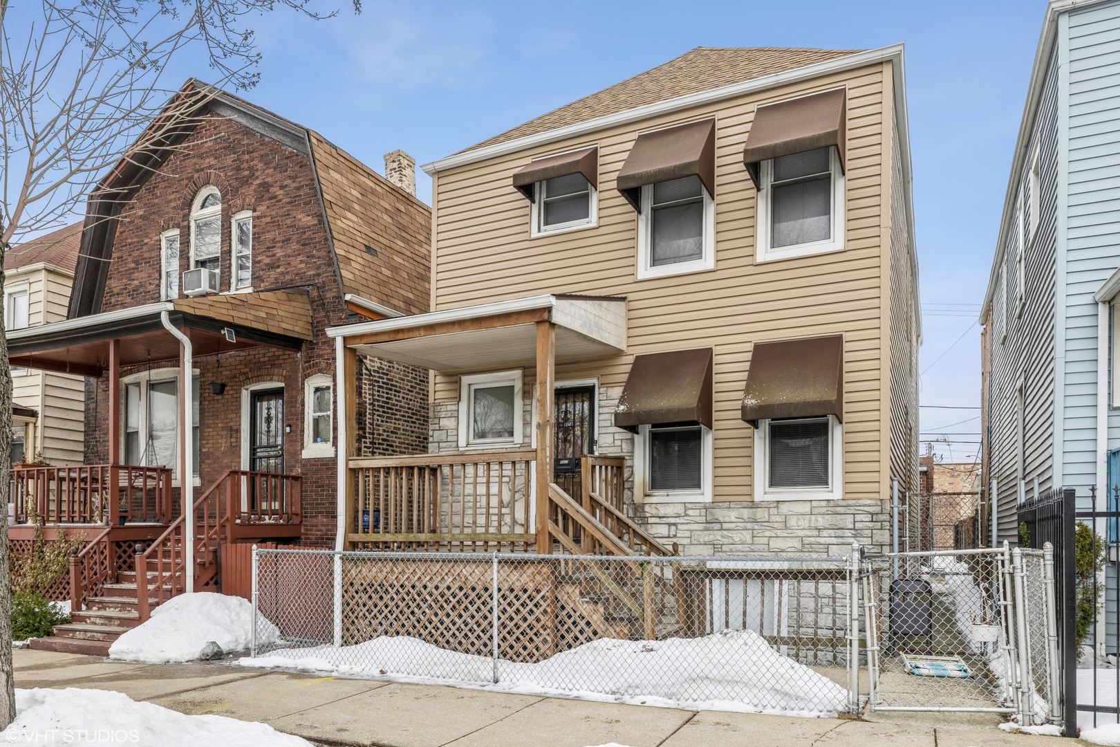 4033 West Cermak Road Chicago, IL 60623 - Photo 1 of 17 a front view of a house with a yard