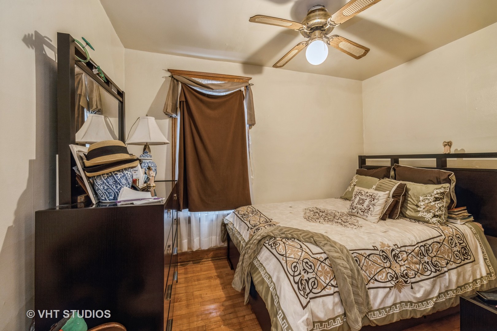 4033 West Cermak Road Chicago, IL 60623 - Photo 11 of 17 a bedroom with a bed and wooden floor