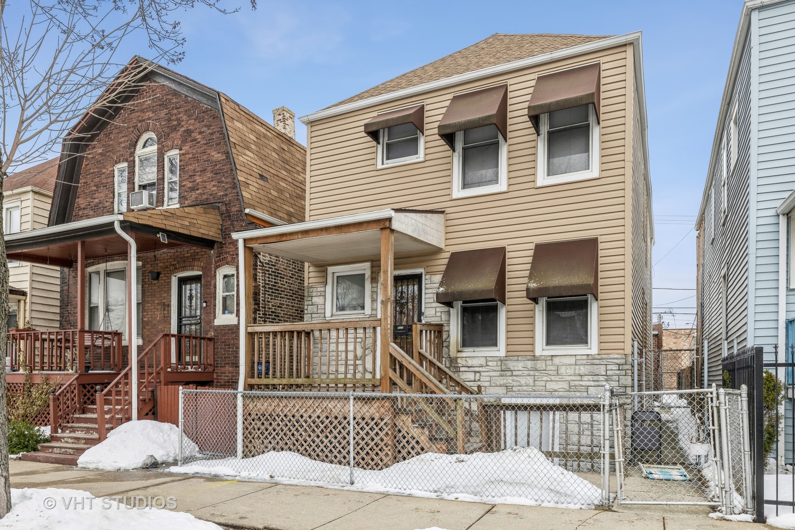 4033 West Cermak Road Chicago, IL 60623 - Photo 2 of 17 a front view of a house with a yard