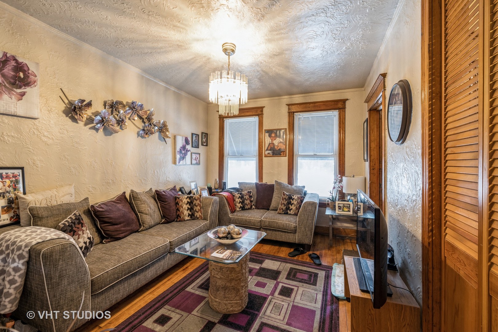 4033 West Cermak Road Chicago, IL 60623 - Photo 3 of 17 a living room with furniture and a chandelier