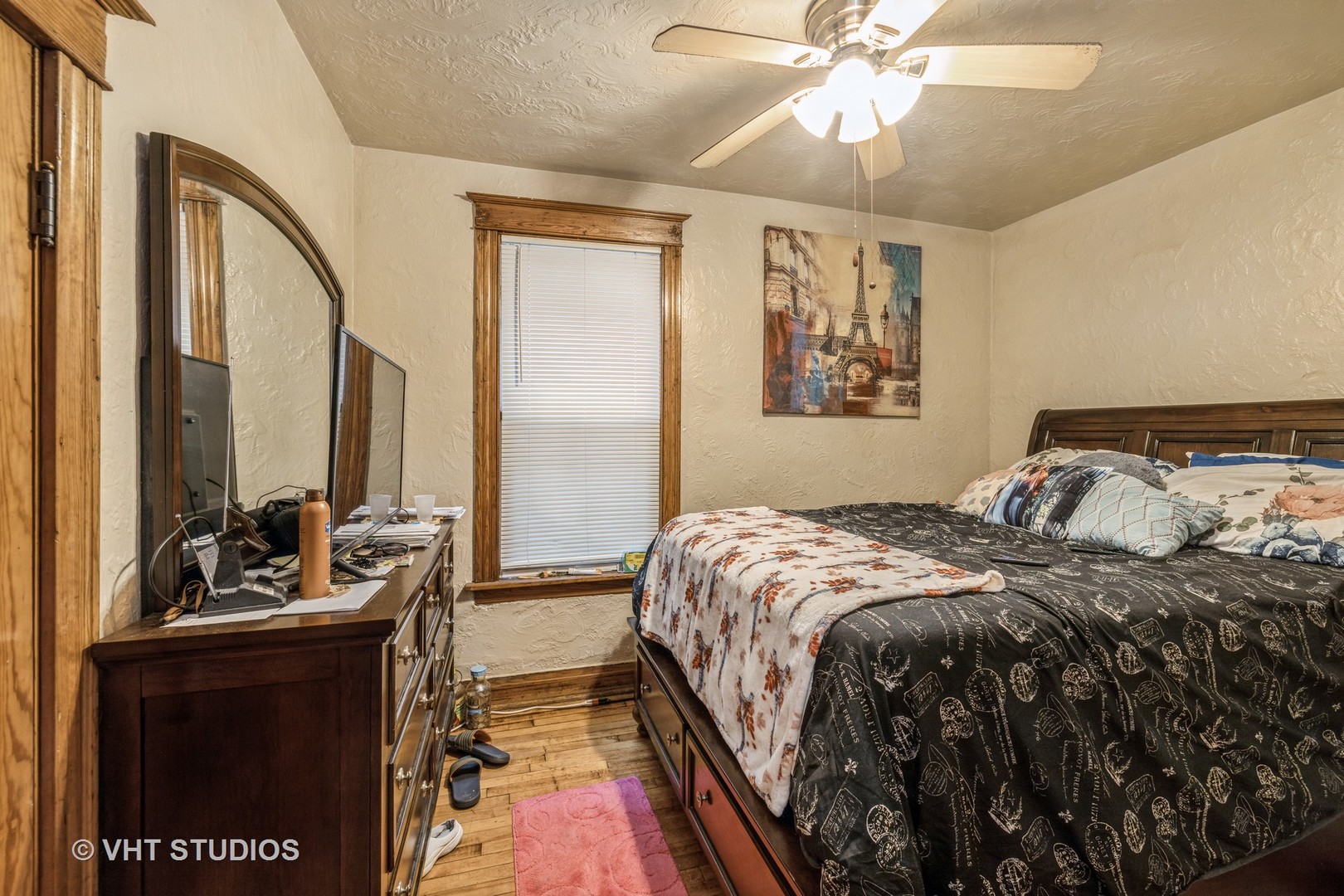4033 West Cermak Road Chicago, IL 60623 - Photo 4 of 17 a bedroom with a bed and ceiling fan