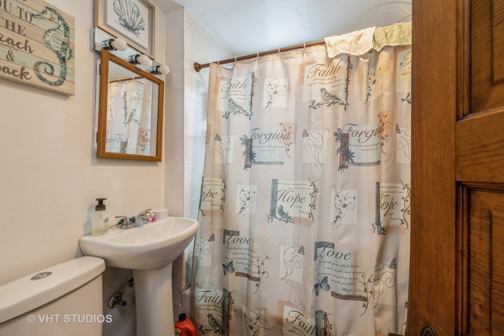 4033 West Cermak Road Chicago, IL 60623 - Photo 5 of 17 a bathroom with a sink and a mirror