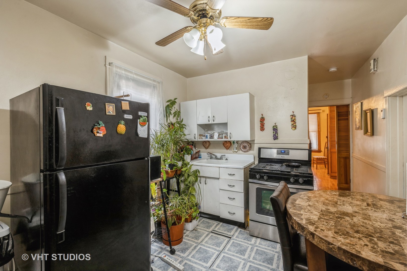 4033 West Cermak Road Chicago, IL 60623 - Photo 9 of 17 a kitchen with stainless steel appliances granite countertop a refrigerator a stove a sink and a refrigerator