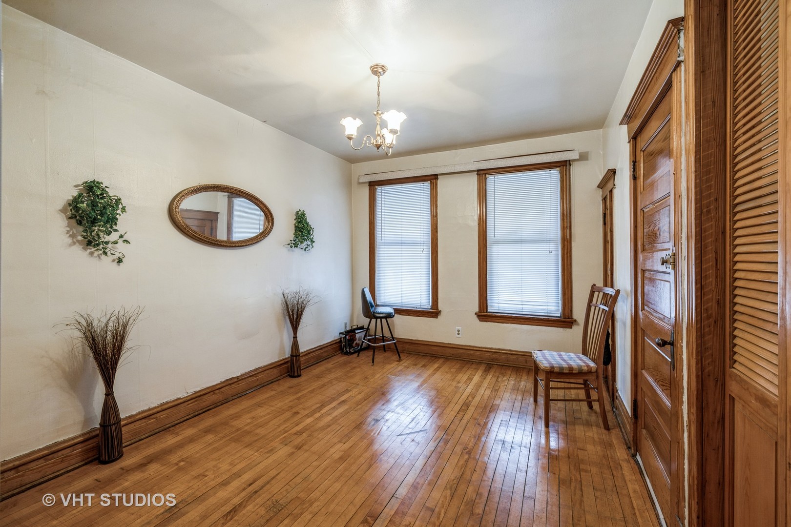 4033 West Cermak Road Chicago, IL 60623 - Photo 10 of 17 a view of an empty room with wooden floor and a window