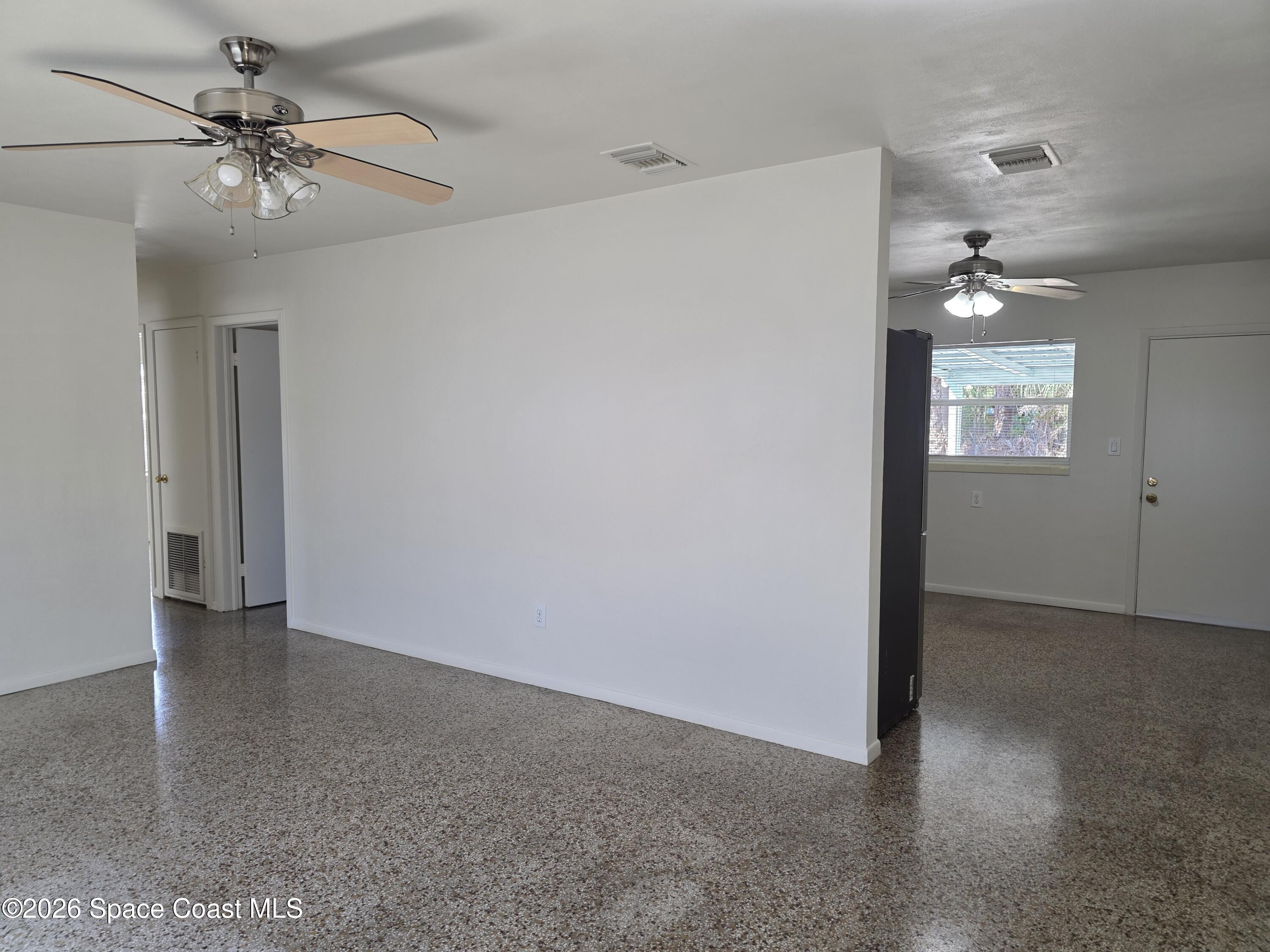 514 Hickory Street Melbourne, FL 32901 - Photo 5 of 27 Living Room Into Kitchen