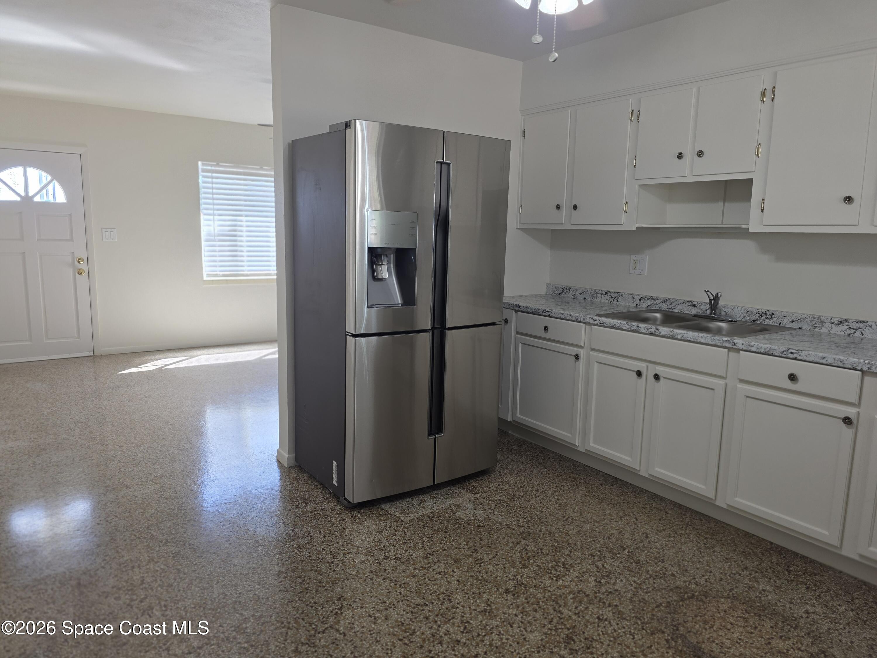 514 Hickory Street Melbourne, FL 32901 - Photo 8 of 27 Kitchen into Lliving Room