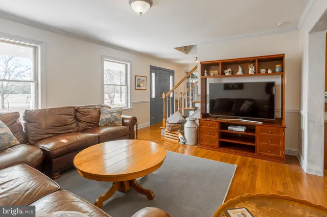 a kitchen with counter top space a sink appliances and cabinets