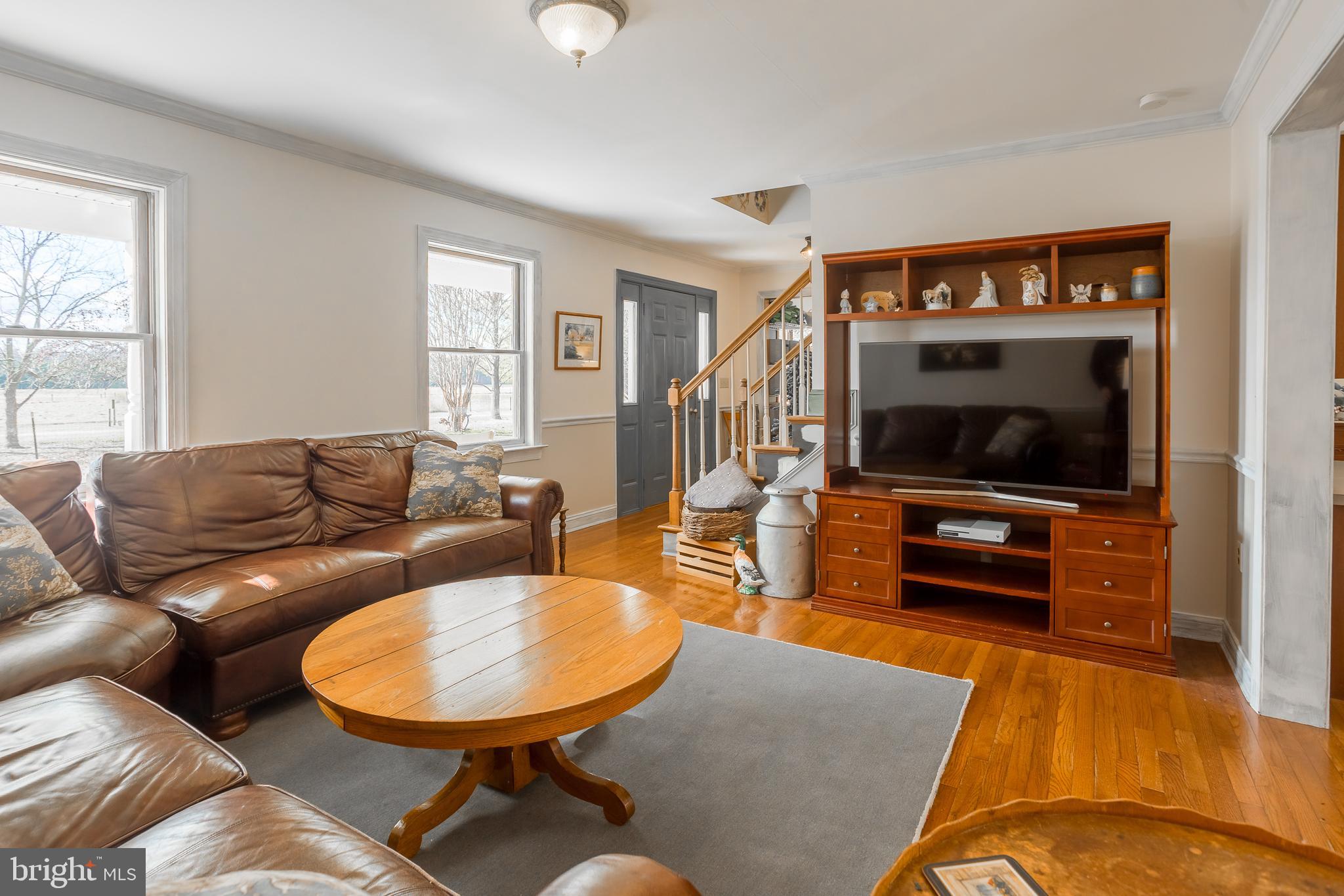 7904 Clark Road Denton, MD 21629 - Photo 12 of 71 a living room with furniture and a flat screen tv