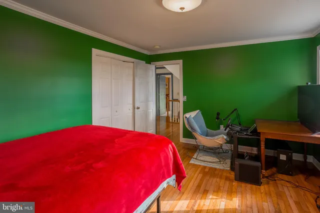 a bedroom with a bed and a chair