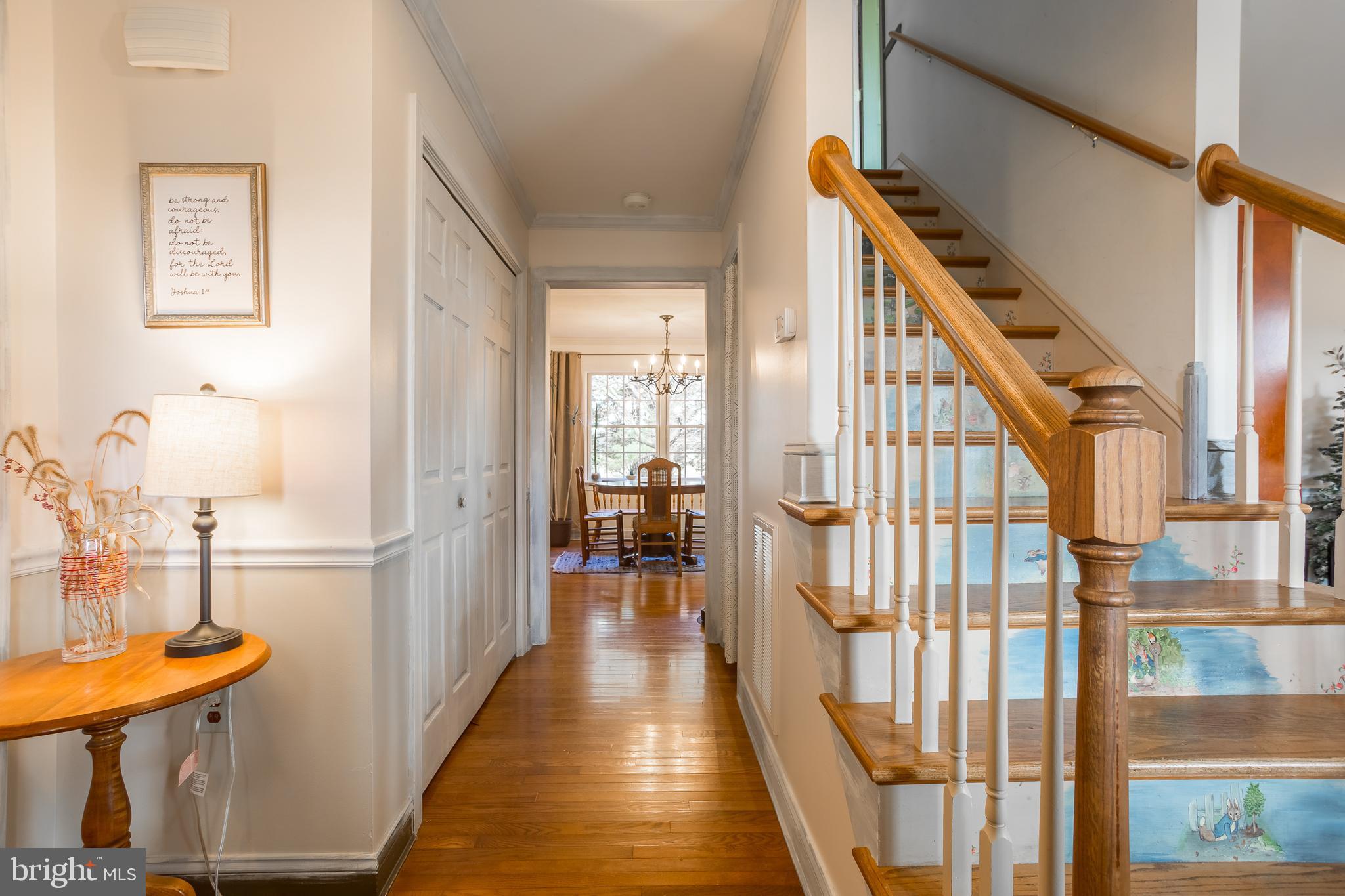 7904 Clark Road Denton, MD 21629 - Photo 5 of 71 a view of a hallway with wooden floor and staircase