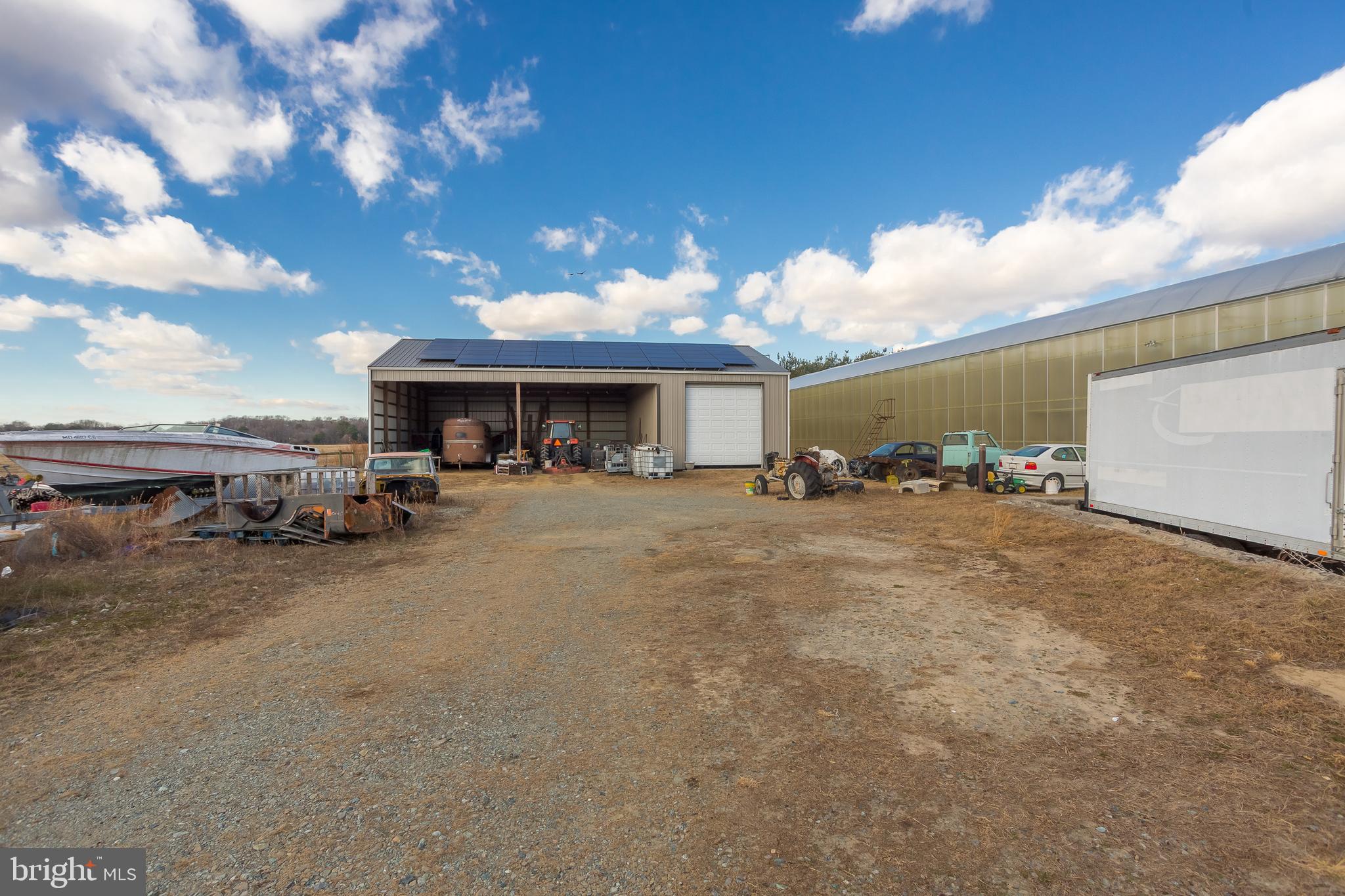 7904 Clark Road Denton, MD 21629 - Photo 65 of 71 a view of a house with a patio