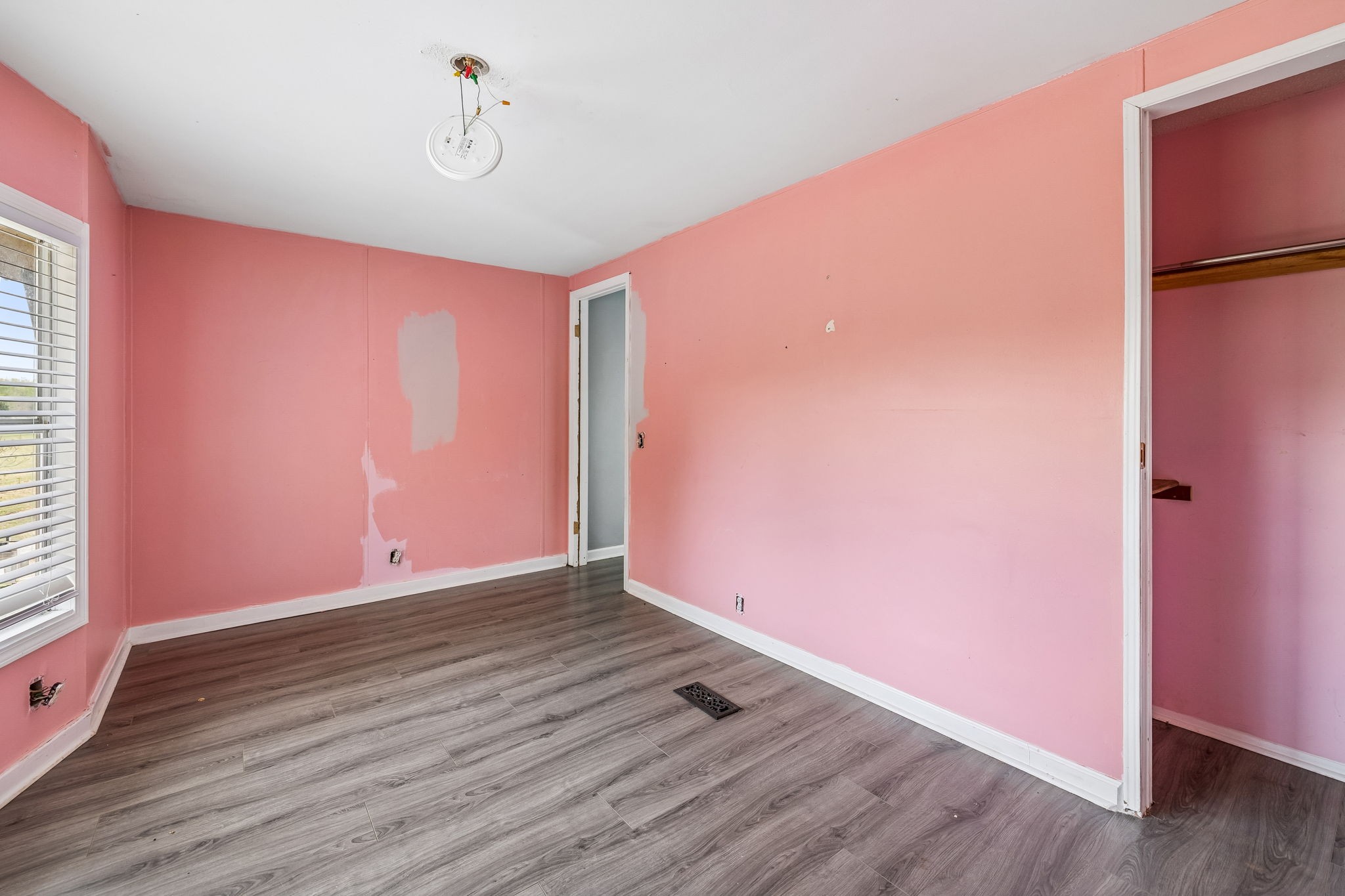 1033 Pollard Road Walling, TN 38587 - Photo 26 of 39 a view of an empty room with wooden floor and a window