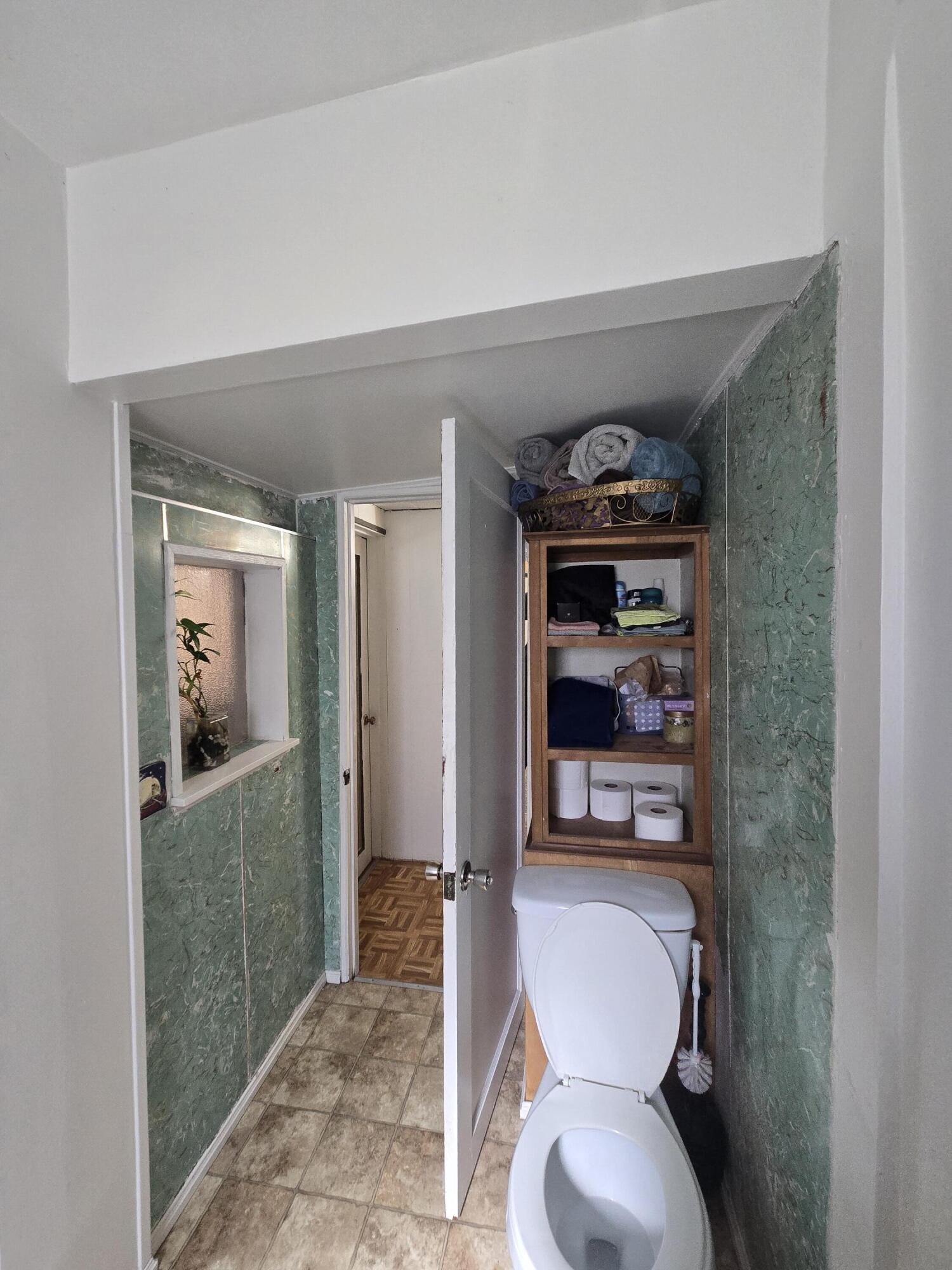 409 East Ash Street Chiloquin, OR 97624 - Photo 22 of 37 a living room with furniture and a toilet