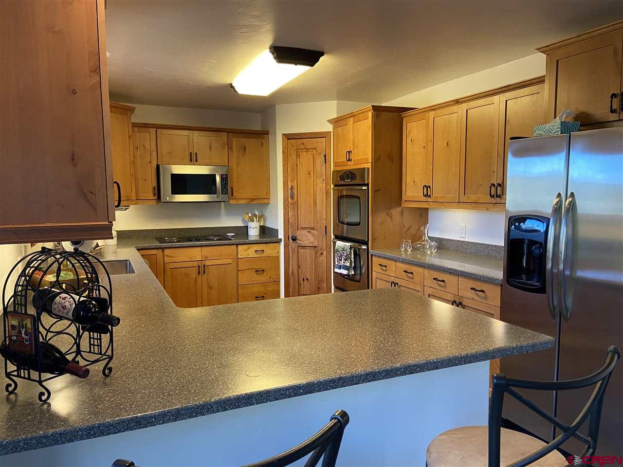 18181 Hanson Road Cedaredge, CO 81413 - Photo 2 of 23 New Counter tops, sink, disposal, beverage cooler and faucet
