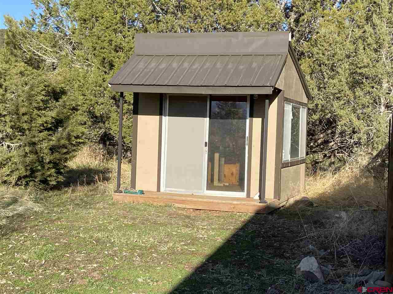 18181 Hanson Road Cedaredge, CO 81413 - Photo 12 of 23 Gardening shed near fenced garden area