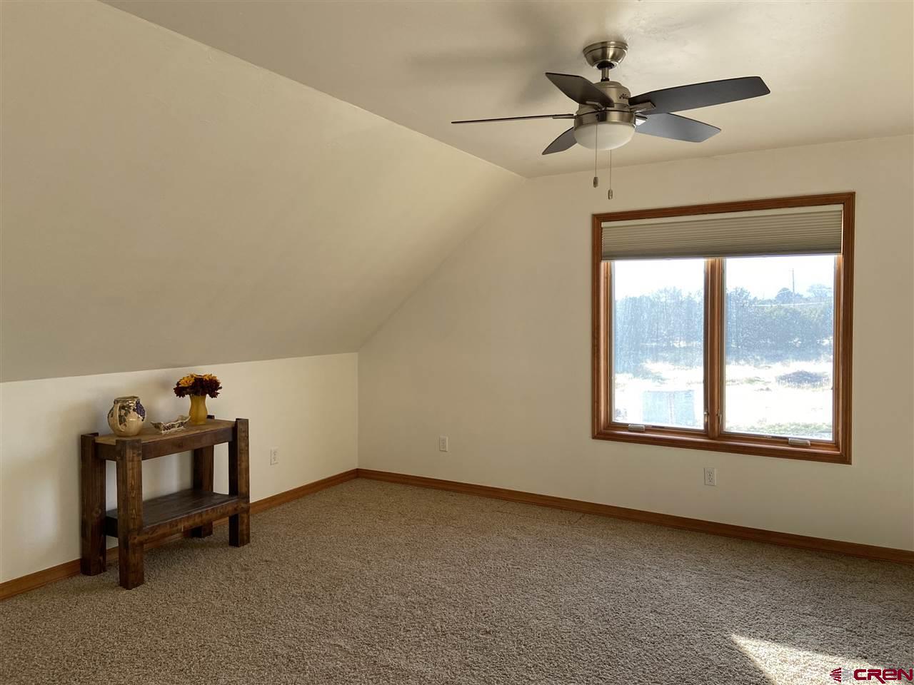 18181 Hanson Road Cedaredge, CO 81413 - Photo 14 of 23 This large bedroom has an ensuite bathroom and an enormous walk in closet.