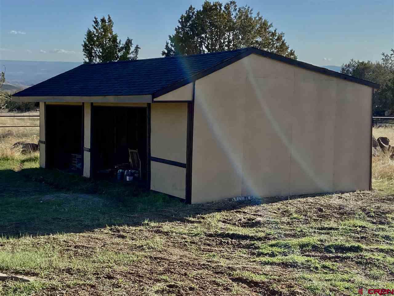 18181 Hanson Road Cedaredge, CO 81413 - Photo 21 of 23 Lean-to. Storage for toys, garden tools or perhaps add a corral and bring your horses.