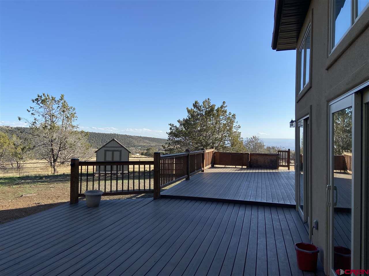 18181 Hanson Road Cedaredge, CO 81413 - Photo 22 of 23 Large Trex deck to enjoy your back yard. Also an additional shed for more storage!