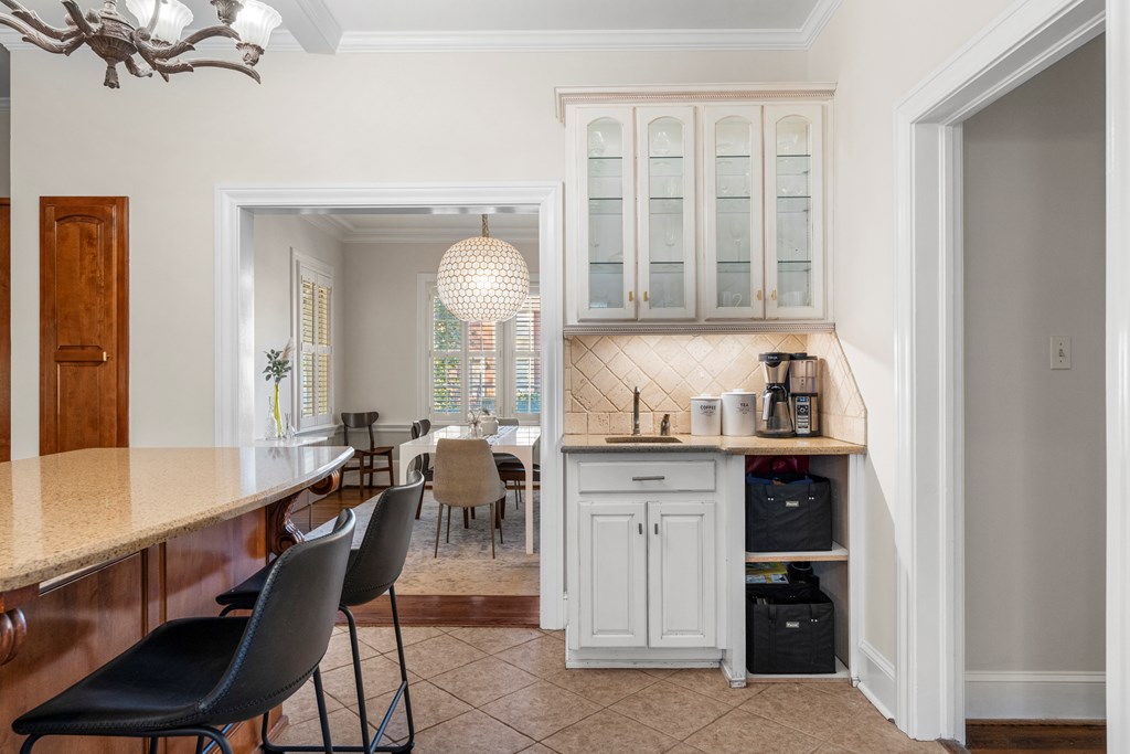 2134 13th Street Columbus, GA 31906 - Photo 11 of 27 a kitchen with a table chairs and entryway
