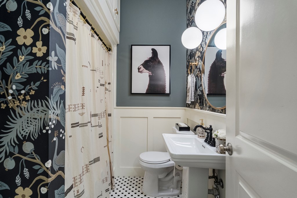 2134 13th Street Columbus, GA 31906 - Photo 18 of 27 a bathroom with a toilet sink and mirror