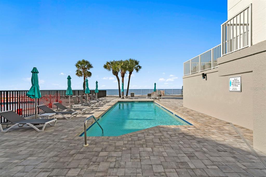 16332 Gulf Boulevard, Unit 3B Redington Beach, FL 33708 - Photo 53 of 91 a view of a backyard with plants and a barbeque