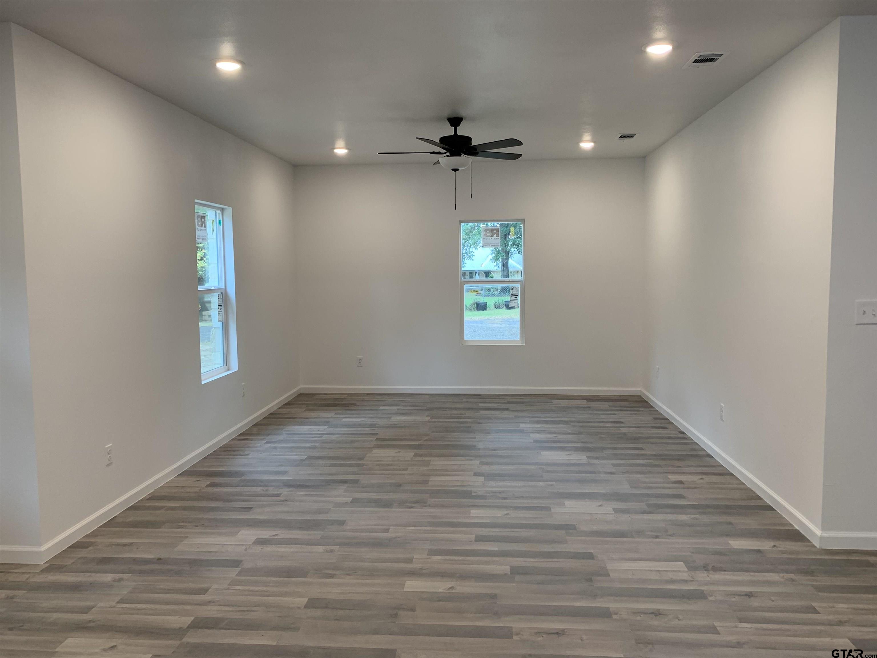 10731 Circle Point Frankston, TX 75763 - Photo 5 of 13 wooden floor in an empty room with a window
