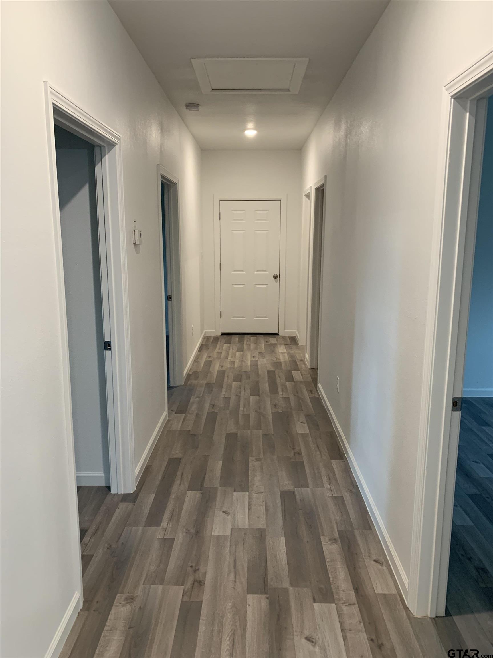 10731 Circle Point Frankston, TX 75763 - Photo 6 of 13 a view of a hallway with wooden floor