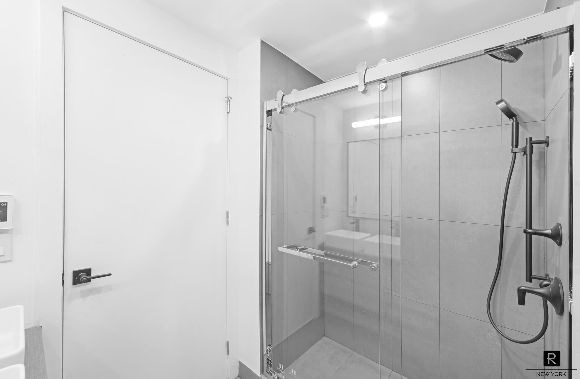340 Metropolitan Avenue, Unit 5B Brooklyn, NY 11211 - Photo 12 of 12 a bathroom with a shower