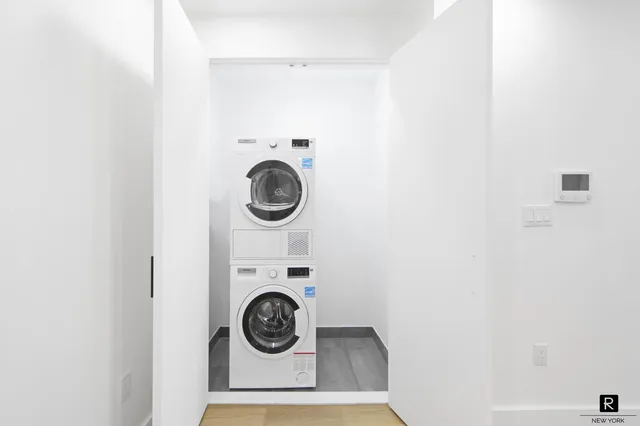 a bathroom with a toilet a sink and a mirror