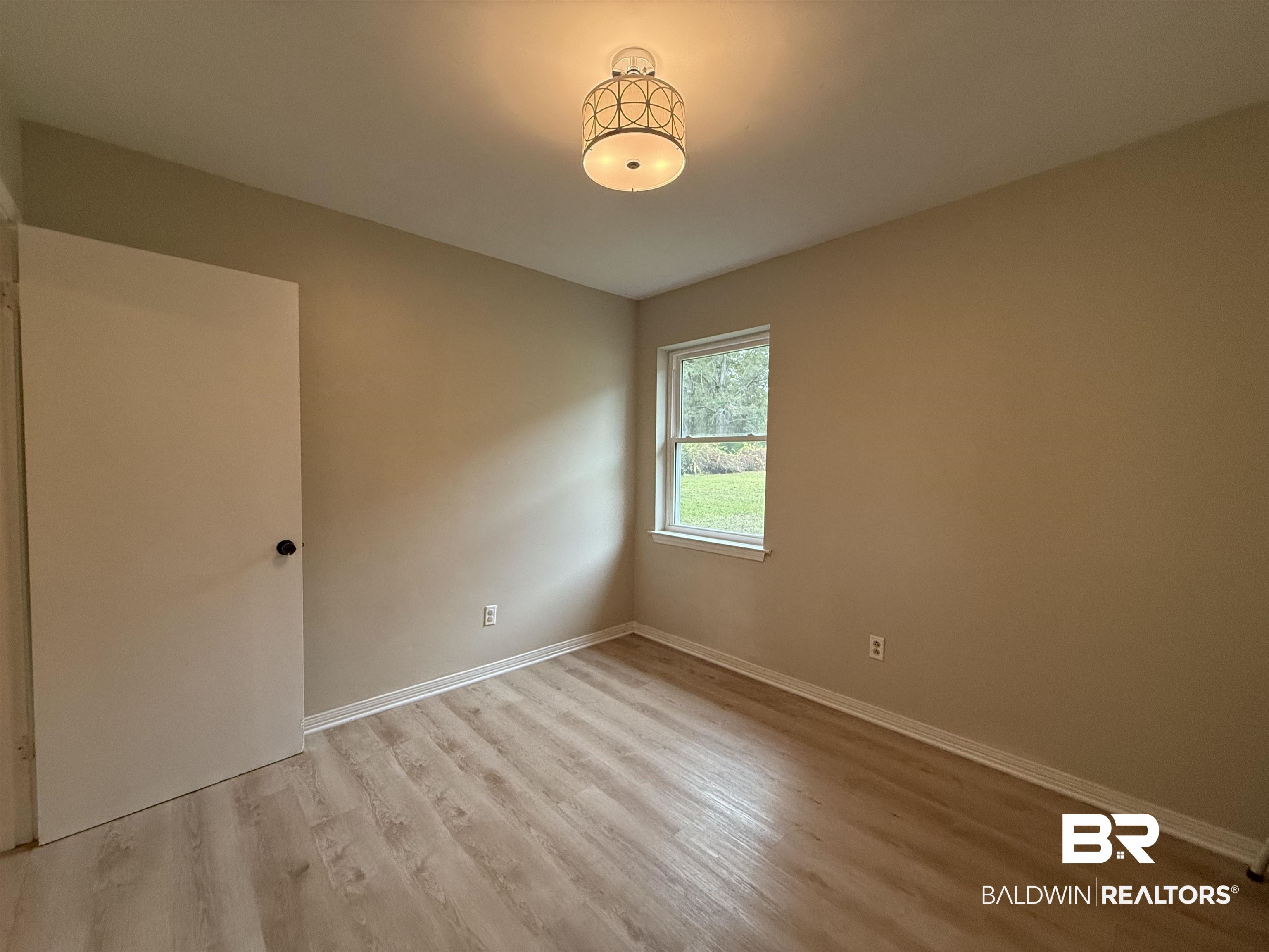 90 Florida Street Monroeville, AL 36460 - Photo 26 of 31 with light hardwood / wood-look vinyl plank flooring