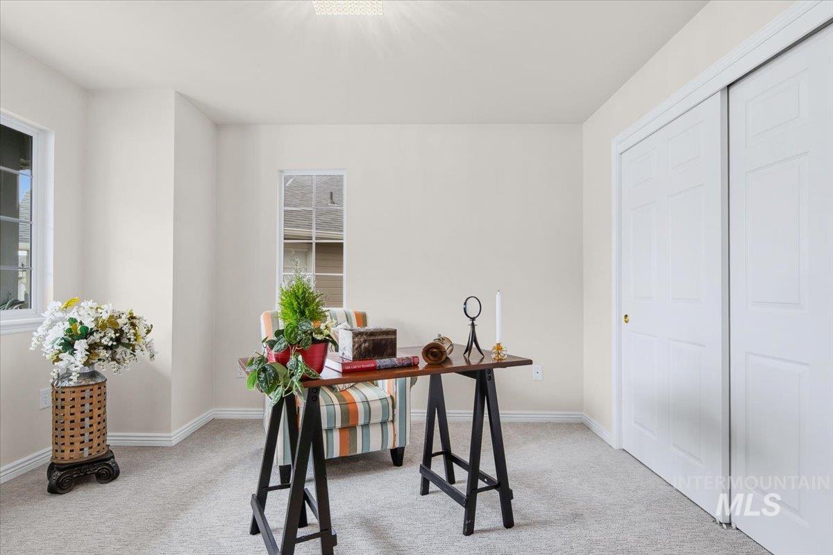 725 North Eagle Road Eagle, ID 83616 - Photo 21 of 45 Neutral-toned walls and light-colored carpeting define this room, featuring two windows with white trim