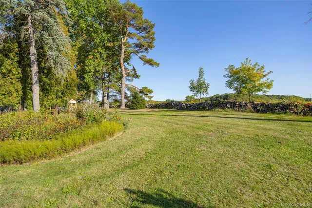 an aerial view of a houses with a yard