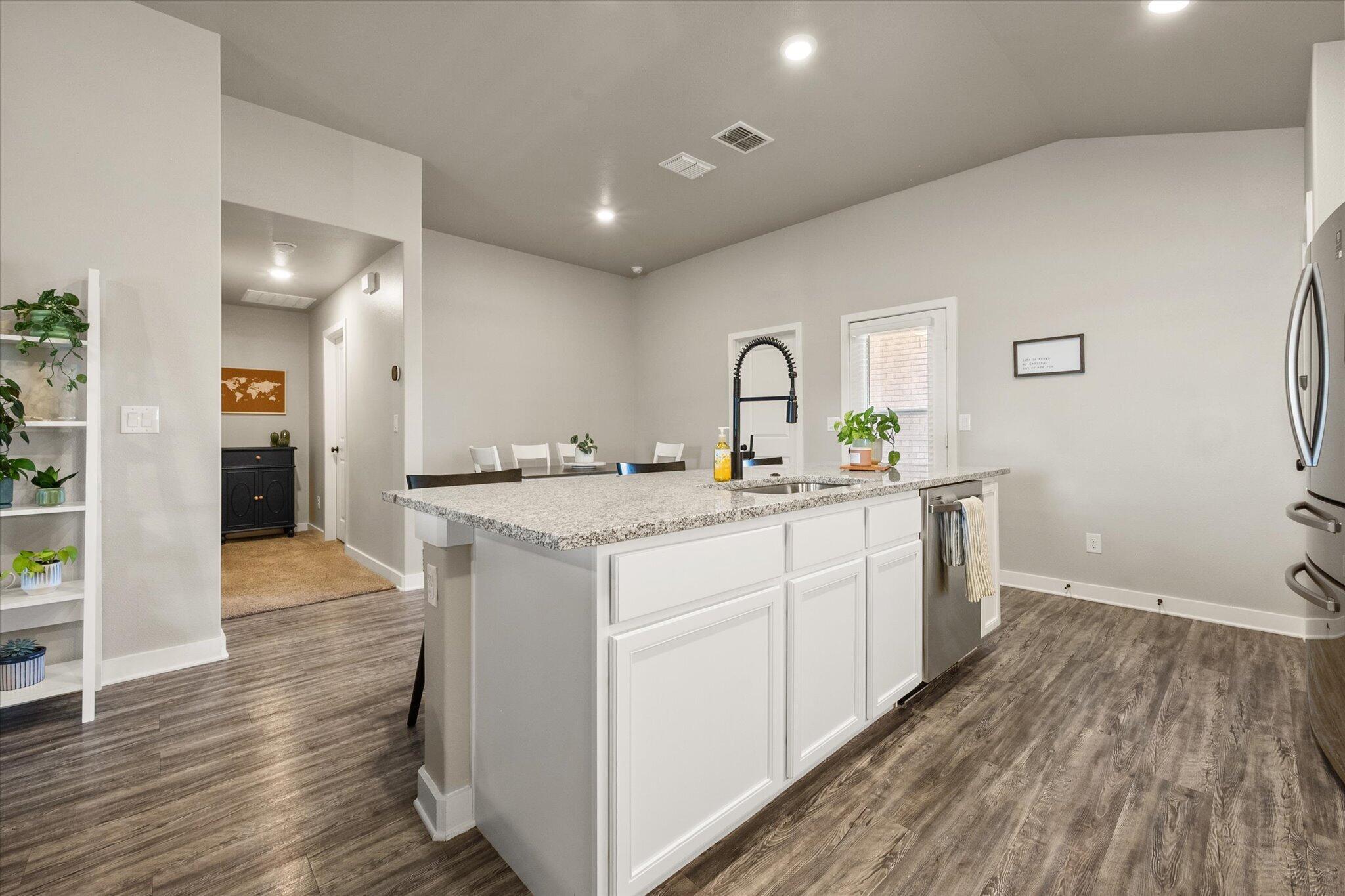 1902 137th Street Lubbock, TX 79423 - Photo 11 of 27 a bathroom with a sink and a mirror