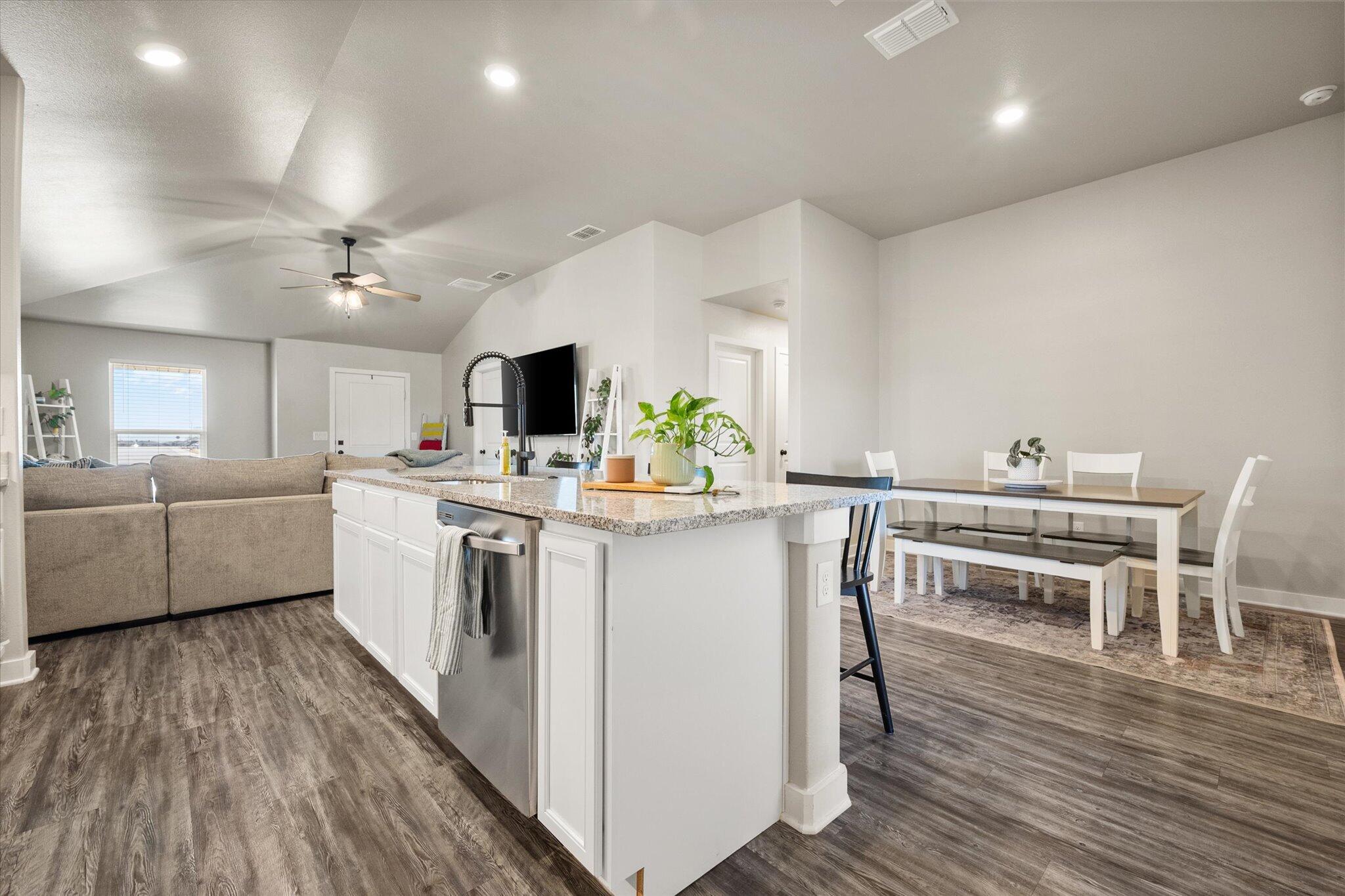 1902 137th Street Lubbock, TX 79423 - Photo 12 of 27 a kitchen with white cabinets and white appliances