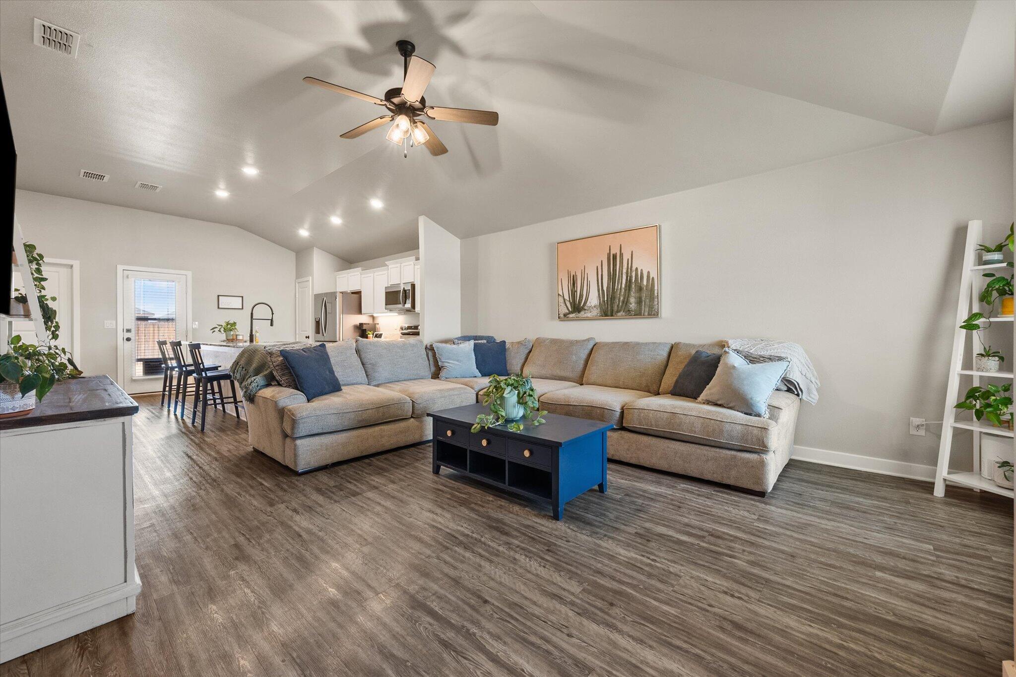 1902 137th Street Lubbock, TX 79423 - Photo 2 of 27 a living room with furniture and wooden floor