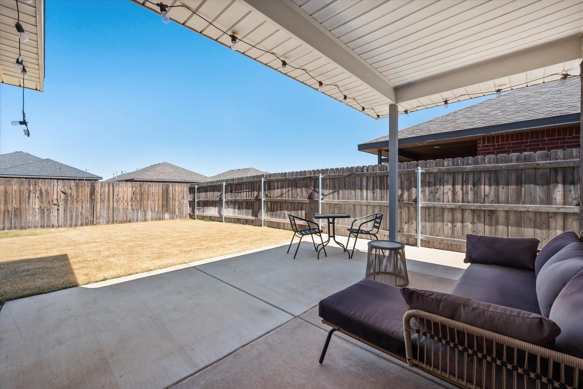 1902 137th Street Lubbock, TX 79423 - Photo 23 of 27 a living room with furniture and a large window