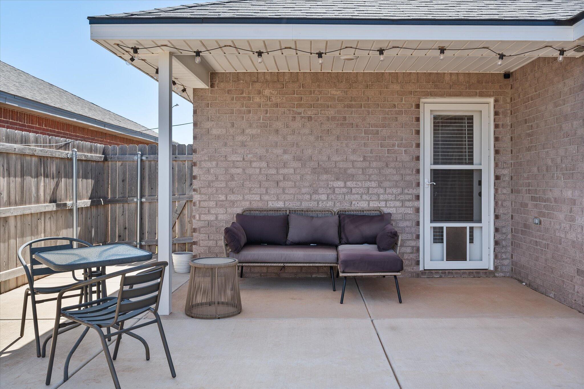 1902 137th Street Lubbock, TX 79423 - Photo 24 of 27 a living room with furniture and a fireplace