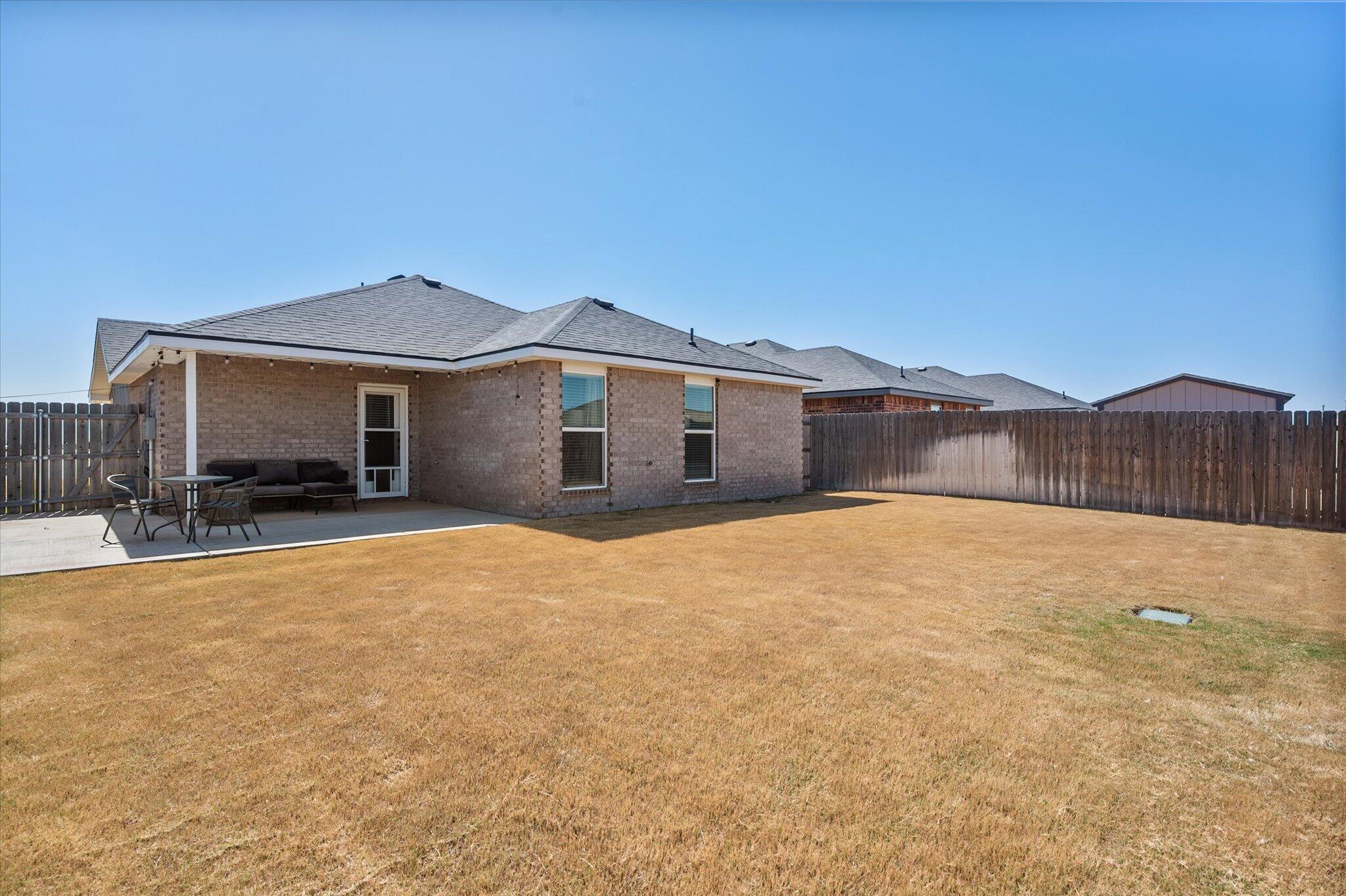 1902 137th Street Lubbock, TX 79423 - Photo 25 of 27 a view of a house with a yard
