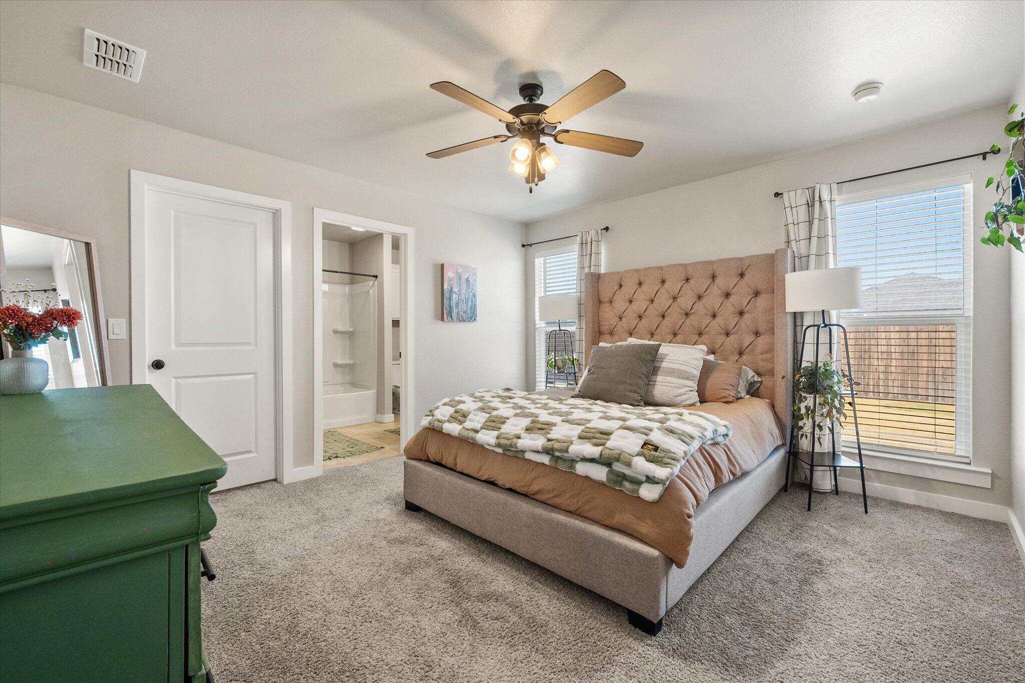 1902 137th Street Lubbock, TX 79423 - Photo 3 of 27 a bedroom with a bed and window