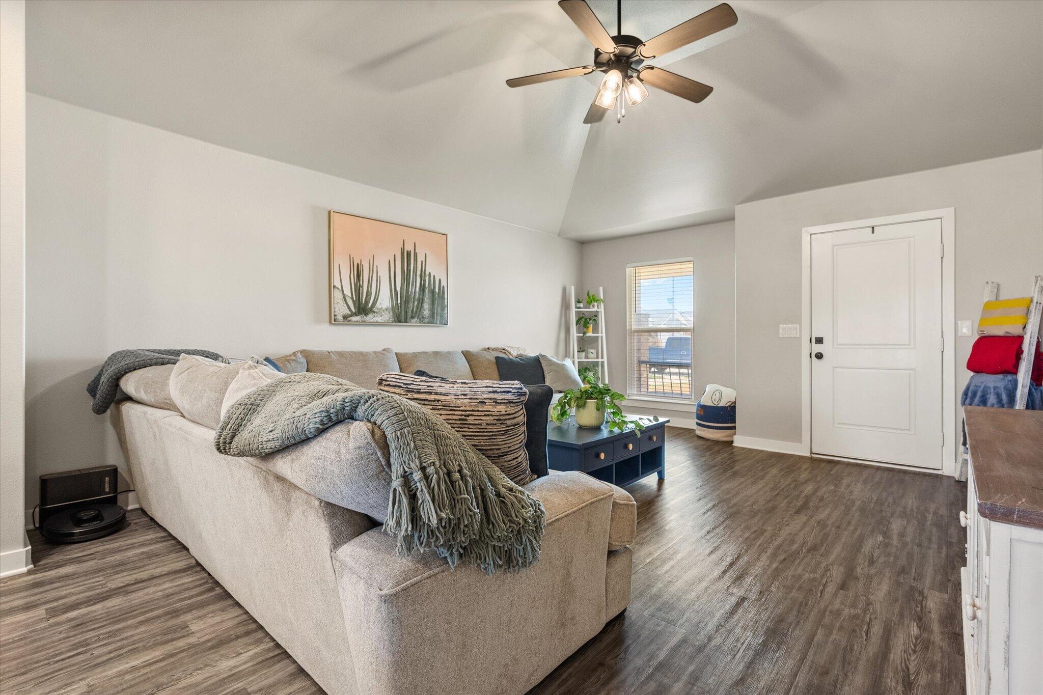 1902 137th Street Lubbock, TX 79423 - Photo 7 of 27 a living room with furniture and wooden floor